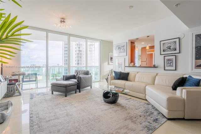 living room with a wall of windows and light tile patterned floors