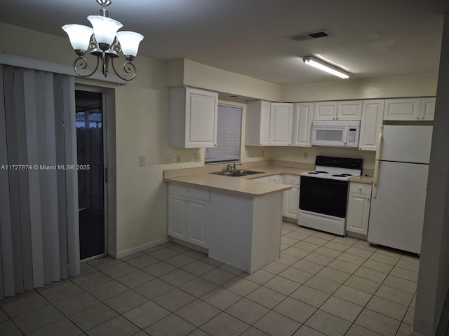 kitchen featuring white appliances, white cabinets, an inviting chandelier, sink, and hanging light fixtures