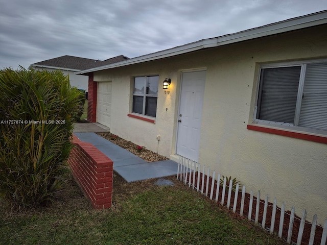 entrance to property featuring a garage