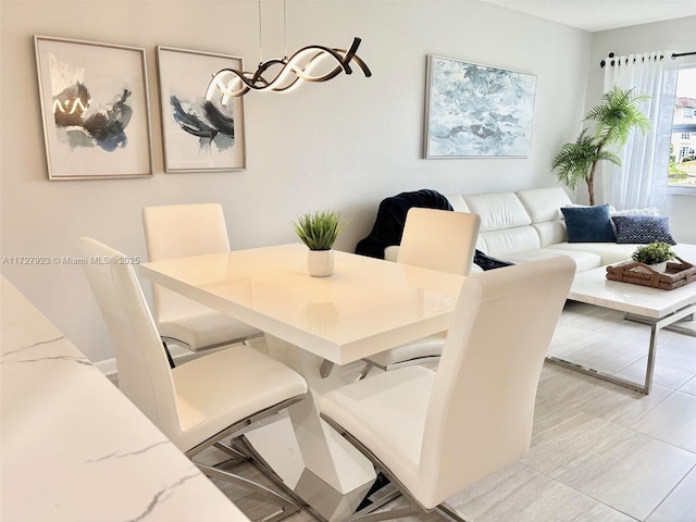 dining space with light tile patterned floors