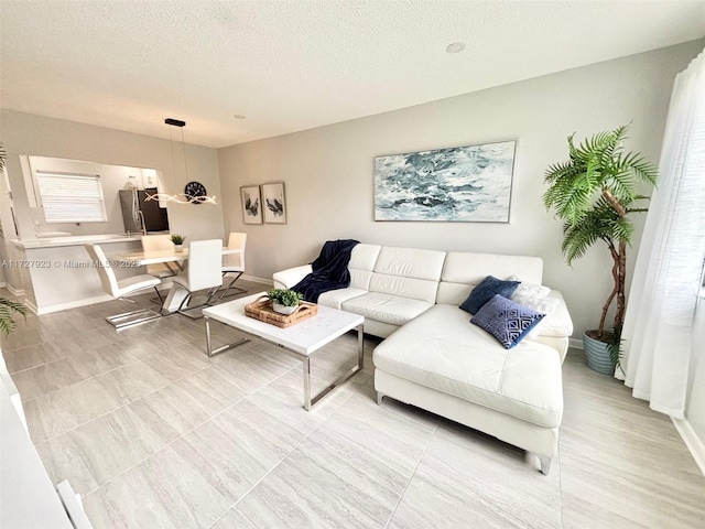 living room featuring a textured ceiling