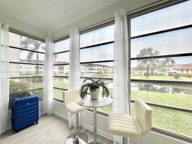 sunroom with a water view