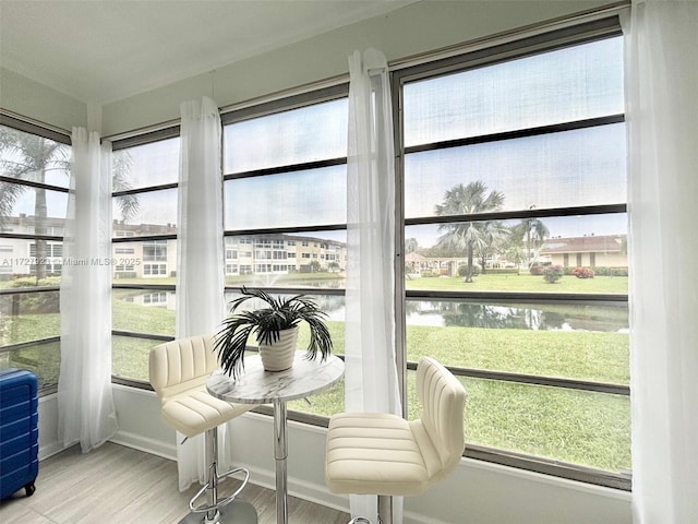 sunroom with a water view