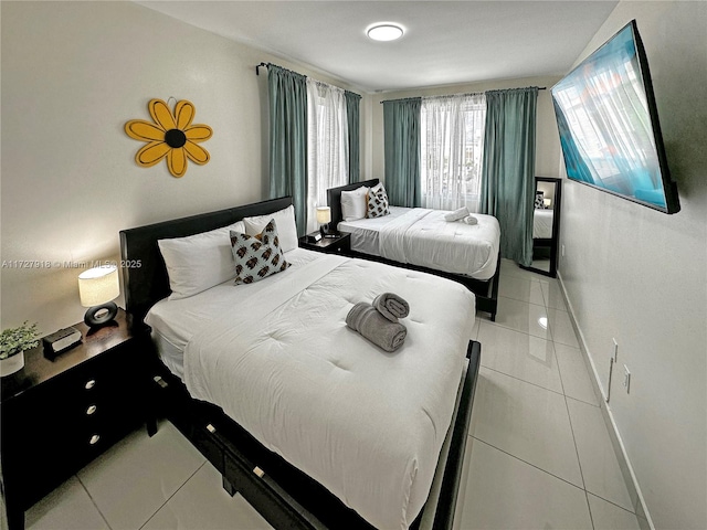 bedroom featuring tile patterned flooring