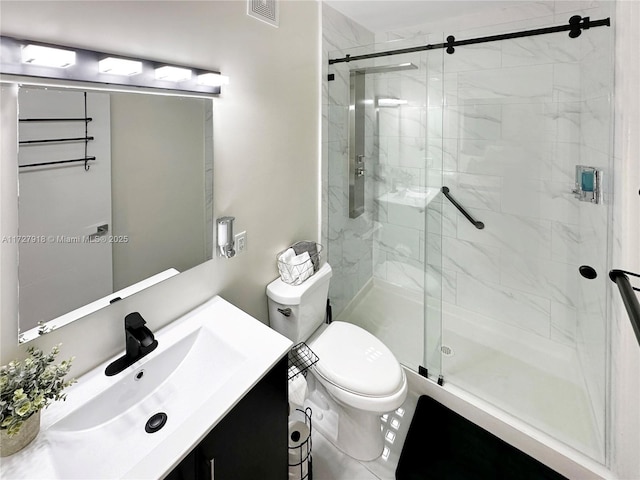 bathroom with toilet, walk in shower, and vanity