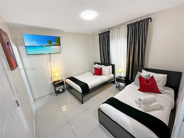 bedroom featuring light tile patterned floors