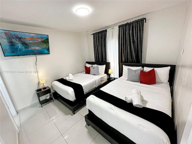 bedroom featuring light tile patterned floors