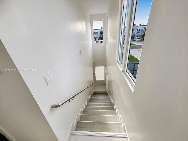 stairs featuring plenty of natural light