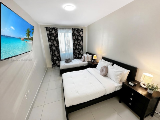 bedroom with light tile patterned flooring