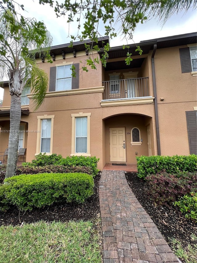 view of front of house featuring a balcony