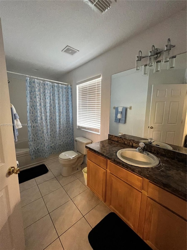 full bathroom with toilet, vanity, tile patterned flooring, shower / bathtub combination with curtain, and a textured ceiling