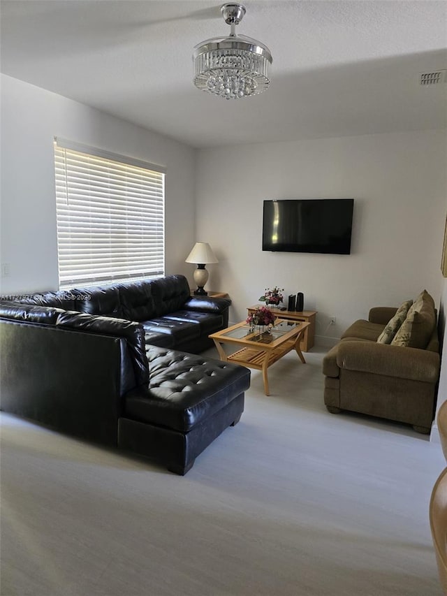 living room with a notable chandelier