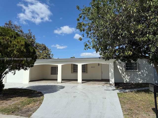 view of front of property featuring a garage