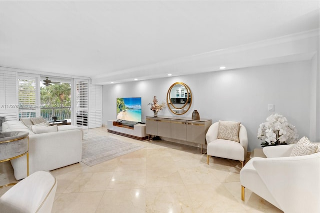 living room featuring expansive windows and ornamental molding