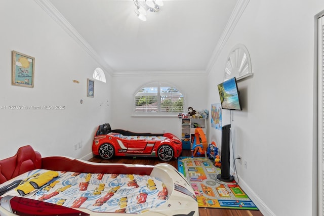 bedroom featuring wood-type flooring and crown molding