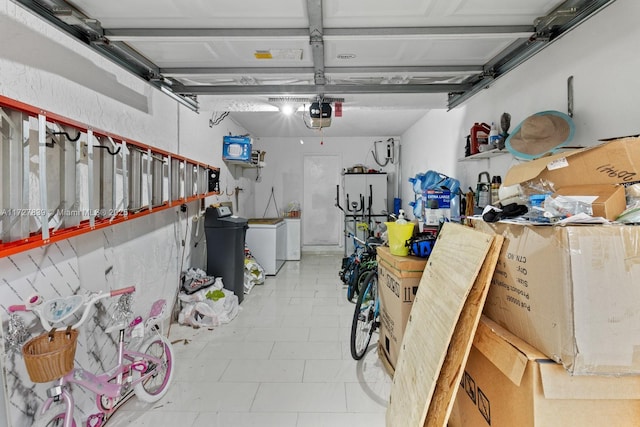 garage featuring a garage door opener and washing machine and clothes dryer