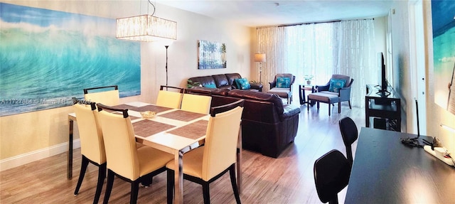 dining room with hardwood / wood-style flooring