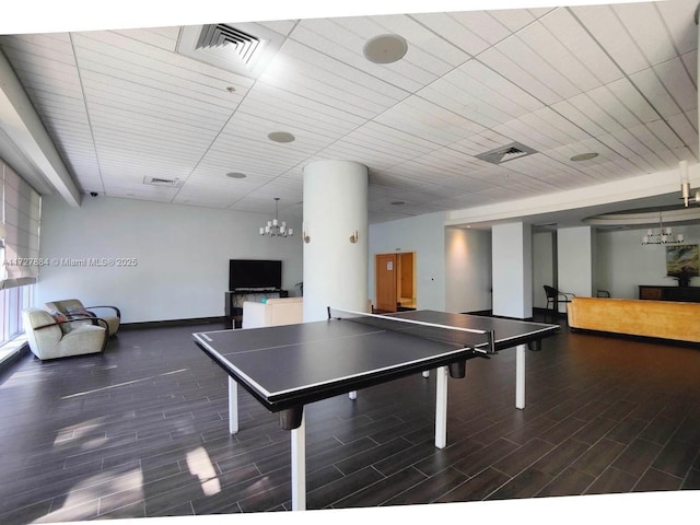 game room featuring a chandelier