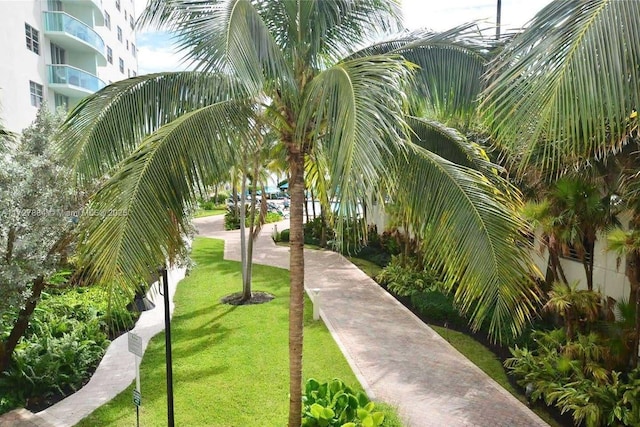 view of home's community featuring a lawn