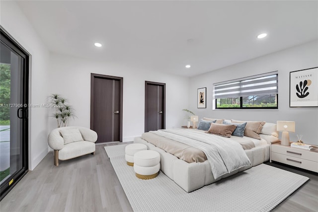 bedroom featuring light wood-type flooring