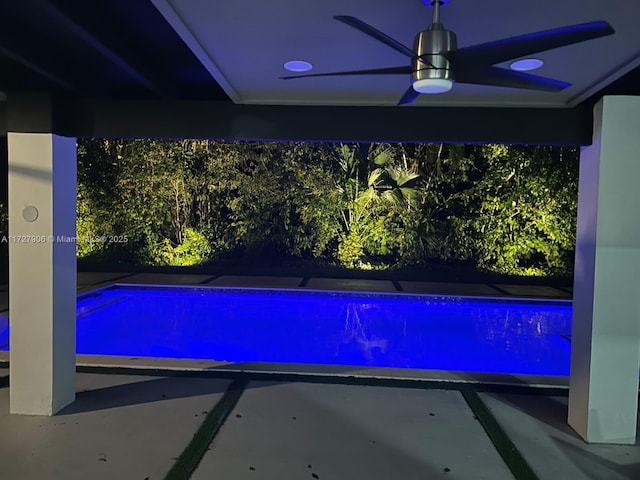 view of pool featuring ceiling fan