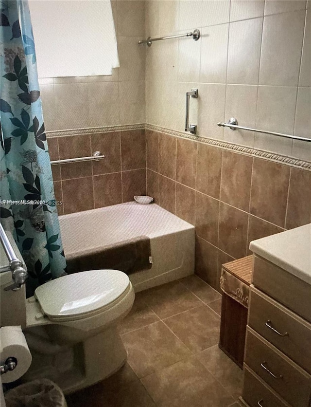 bathroom with toilet, shower / tub combo, tile walls, and tile patterned floors