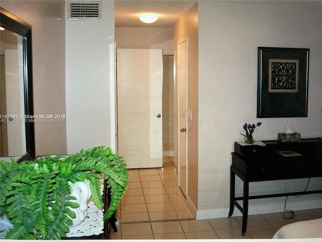 corridor with light tile patterned flooring