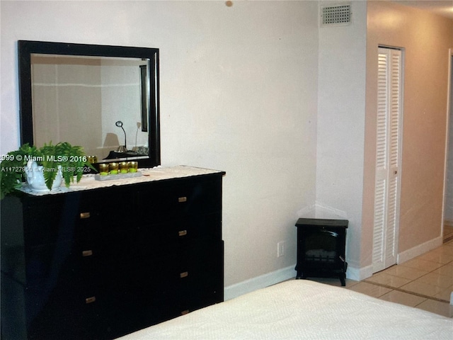 bathroom with tile patterned flooring and vanity