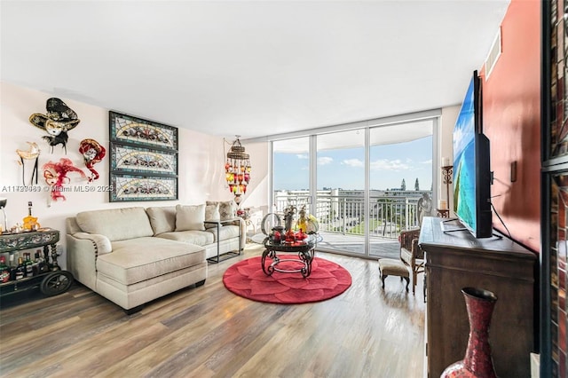 living room with hardwood / wood-style flooring and expansive windows