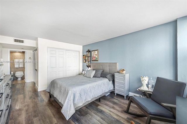 bedroom featuring dark wood-type flooring and a closet