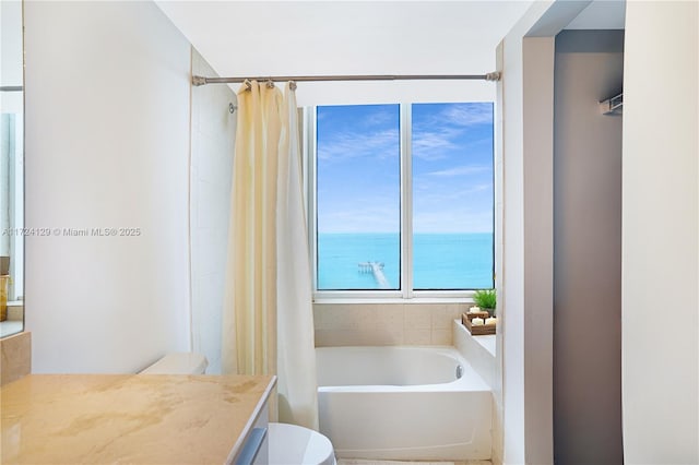 bathroom with vanity, a water view, and toilet