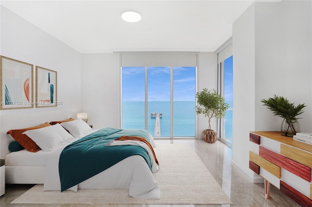 bedroom featuring a water view, ornamental molding, floor to ceiling windows, and access to outside