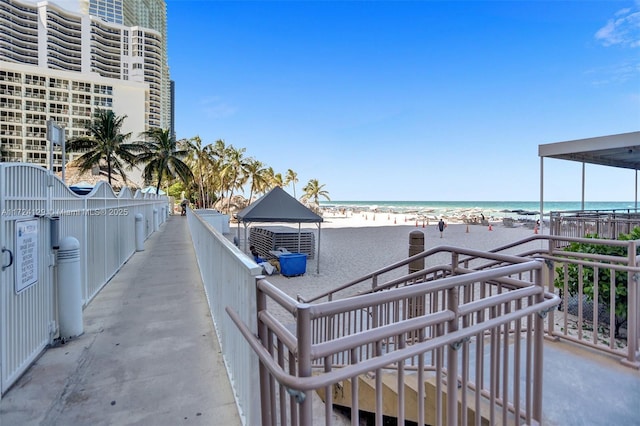 exterior space with a view of the beach and a gazebo