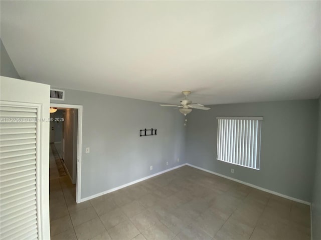 unfurnished room with ceiling fan