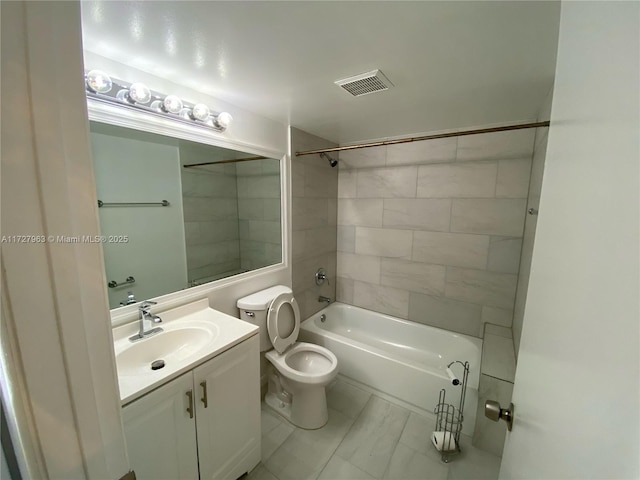 full bathroom with toilet, tile patterned flooring, tiled shower / bath, and vanity