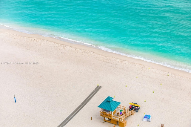 aerial view with a beach view and a water view