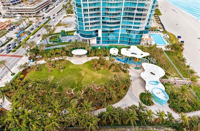 drone / aerial view featuring a view of the beach and a water view