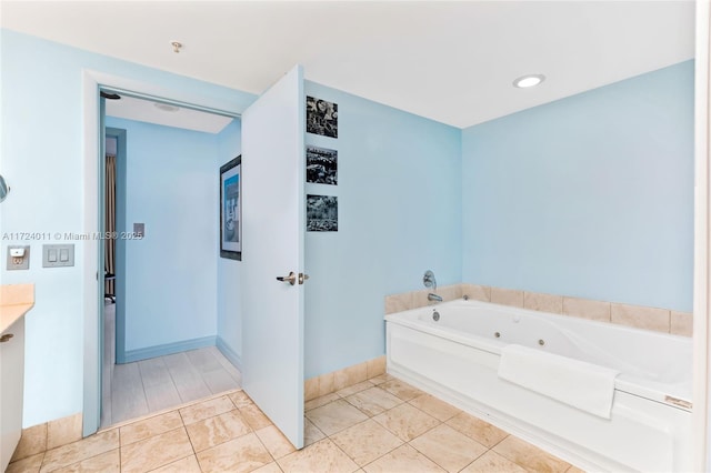 bathroom with tile patterned floors and a washtub