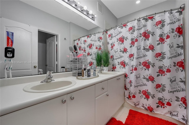 bathroom with tile patterned flooring, vanity, and a shower with curtain