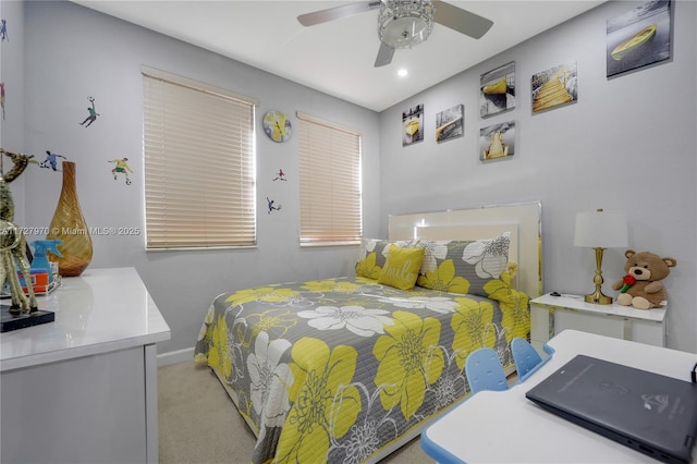 bedroom featuring ceiling fan and light colored carpet