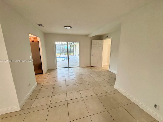 empty room with light tile patterned floors