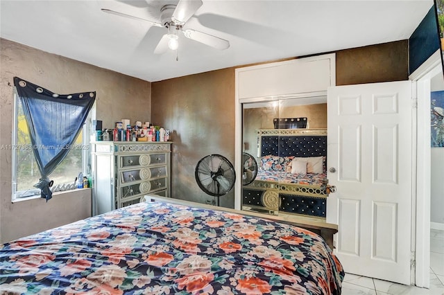 bedroom with ceiling fan and a closet