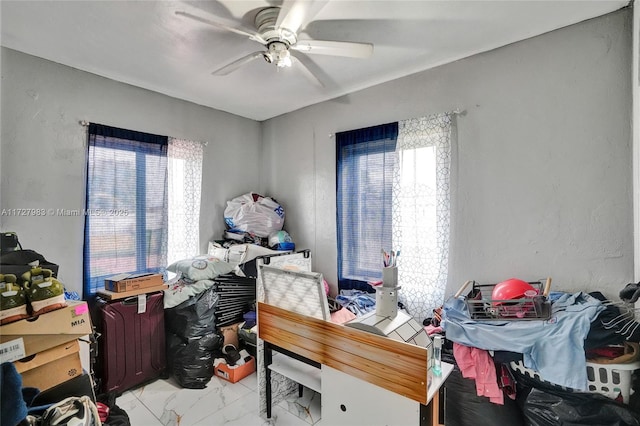 office featuring ceiling fan and a wealth of natural light