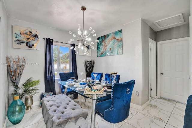 dining area featuring a notable chandelier