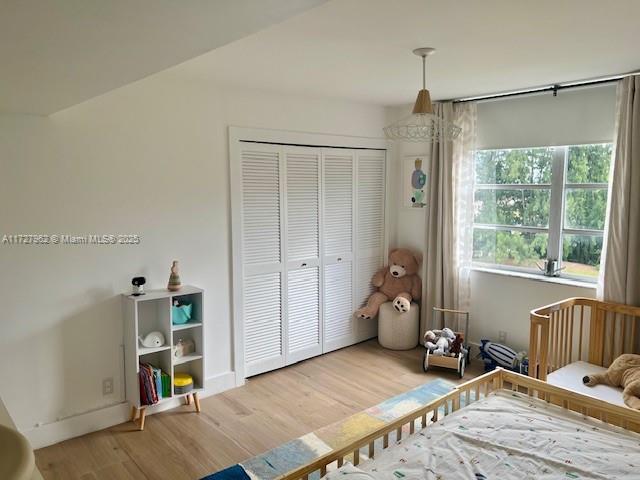 bedroom featuring a closet and hardwood / wood-style floors