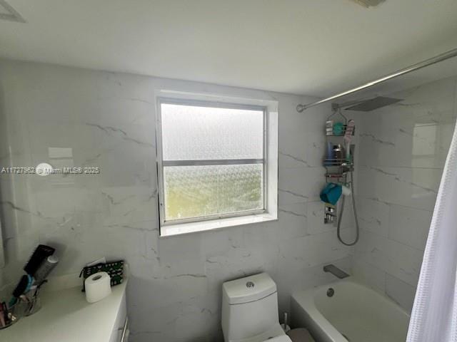 bathroom featuring a wealth of natural light, toilet, and shower / bath combination with curtain