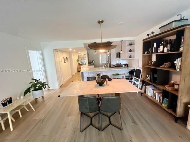 dining room featuring light hardwood / wood-style flooring