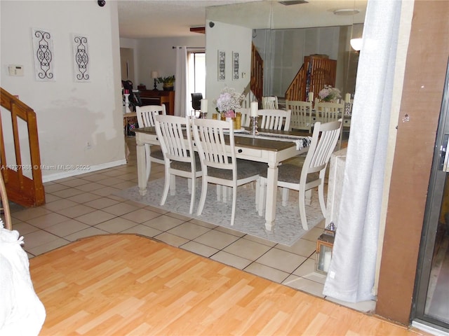 dining area with tile patterned flooring