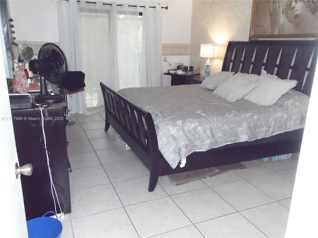 bedroom with light tile patterned floors