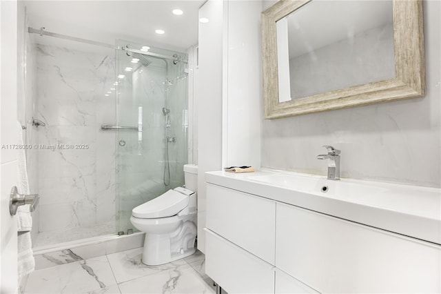 bathroom with vanity, toilet, and a shower with shower door